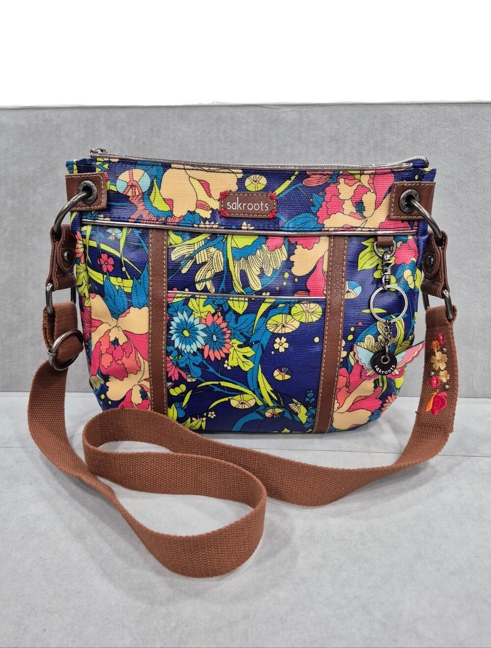 Sakroots Boho crossbody bag blue pink colorful 9x11x2 in floral butterfly charm